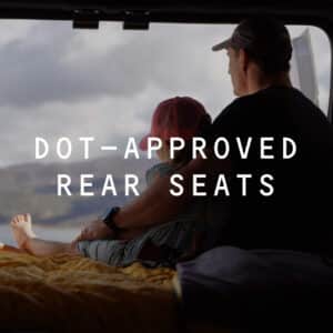 Father & Daughter looking out the back of a Squad Campervan.