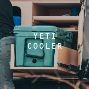 YETI cooler slide-out in the kitchen of the Squad Campervan